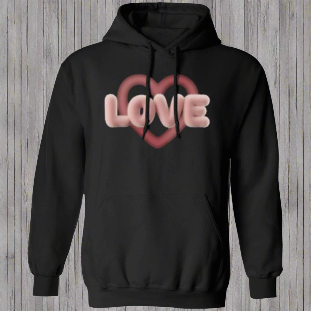 Love Heart Pink Hoodie featuring a minimalistic heart graphic with a soft pink and textured love design. Available in a relaxed fit, perfect for everyday wear.